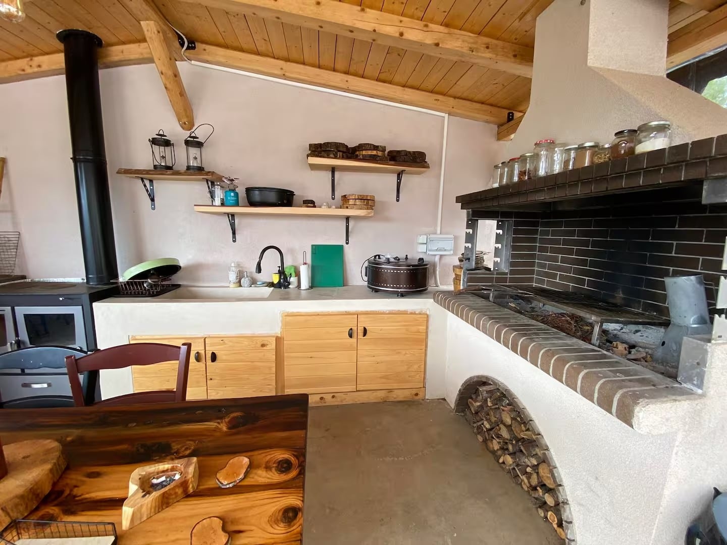 The brick barbecue and worktop of the outdoor kitchen